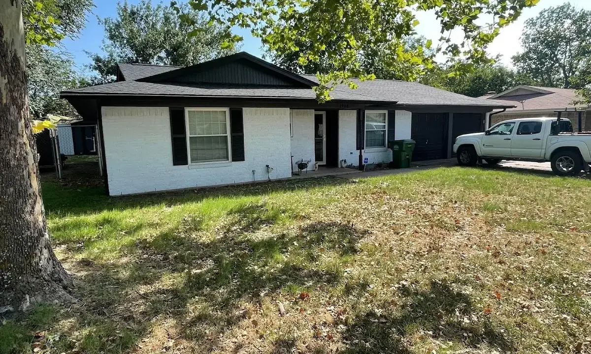 Professional roofing crew working on a residential roof in Perryton